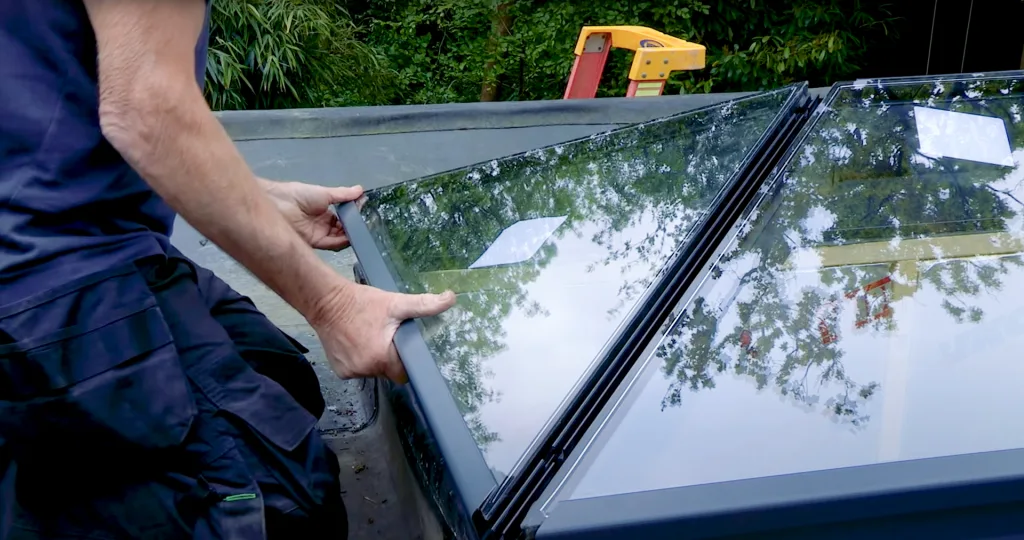 Roger installing the glass onto the frame of the Korniche Roof Lantern