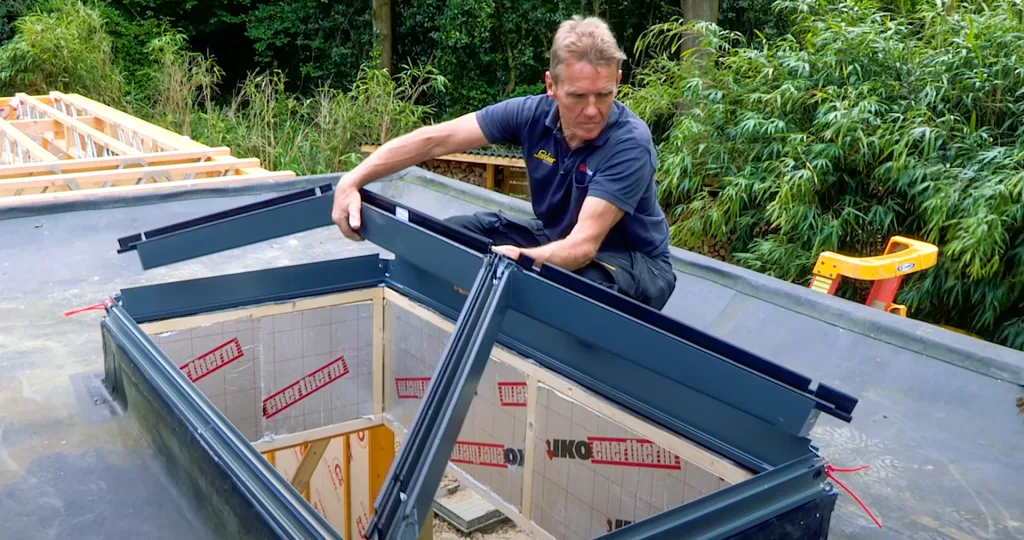 Roger Bisby (Skill Builder) positioning the spider frame onto the eaves beam