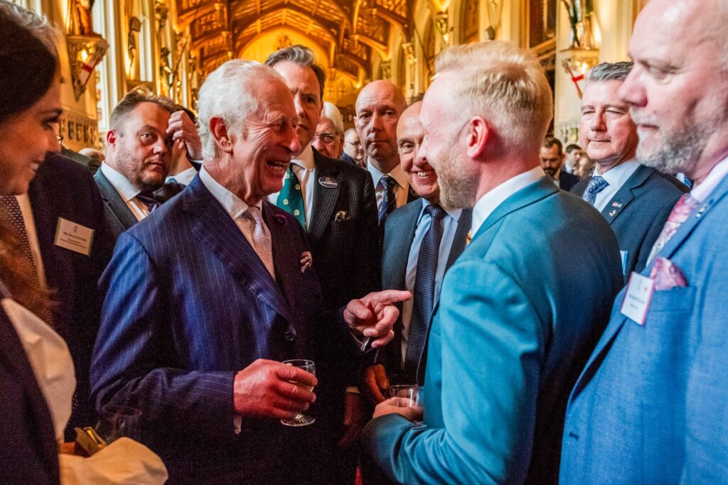 King Charles laughs and points with Made For Trade Managing Director Bradley Gaunt at the King's Award For Enterprise 2024 reception.