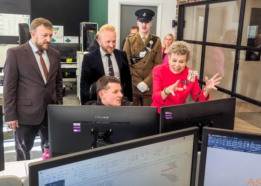 Matt Imlah, Product Design Technician at Made For Trade, showing His Majesty's Lord Lieutenant of County Durham, Mrs Sue Snowdon, his latest product designs on his computer.