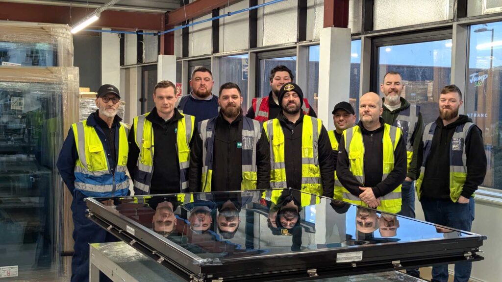 The Korniche team poses proudly behind a recently manufactured Korniche Roof Lantern.